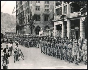 English soldiers marching down Nathan Road after liberating the Colony