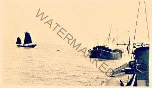 A burning ship, attacked by pirates in Bias Bay 1930s